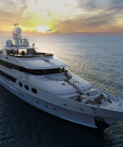 Modern superyacht at sunset